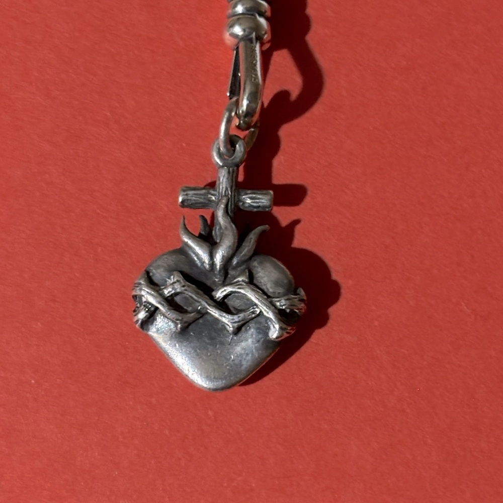 Rare retired sacred heart charm
Like new
